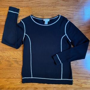Talbots woman’s long sleeve black knit top with white stitching.